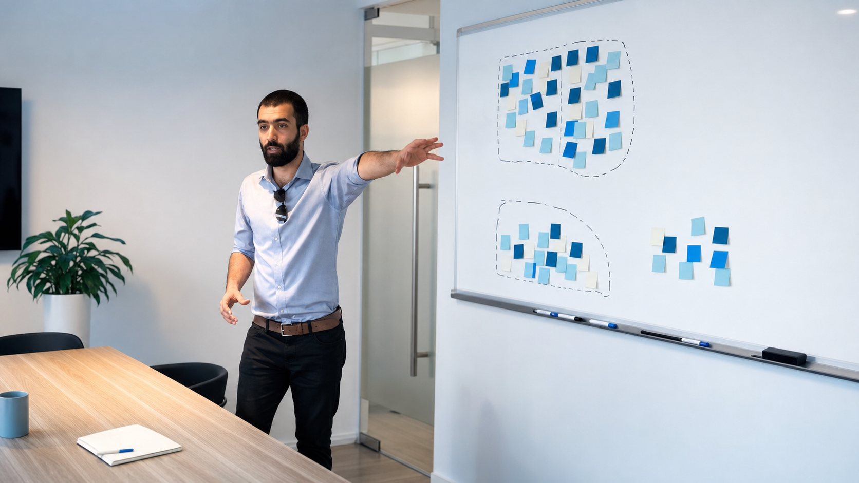 Saad Kakakhel explaining a managing conflict lesson at an SMBtv whiteboard.
